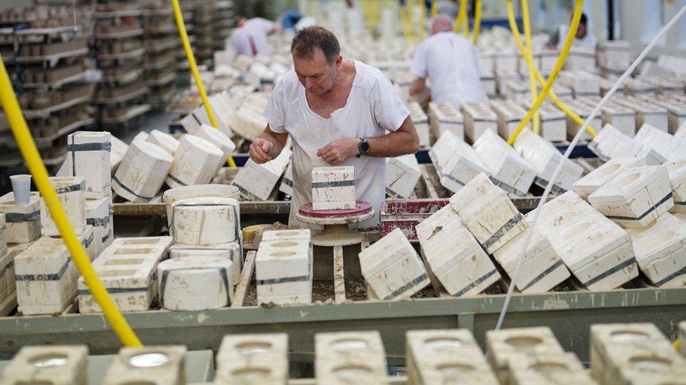 King Charles III themed mugs on display during the production of hand-decorated pieces from the forthcoming Coronation collection, at the Emma Bridgewater Pottery Factory in Stoke on Trent.