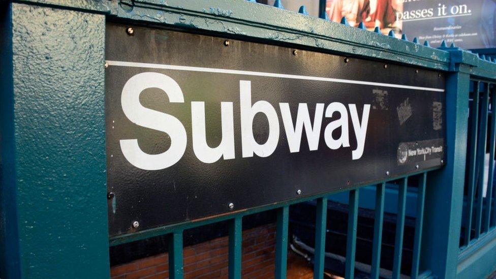 A New York subway entrance sign