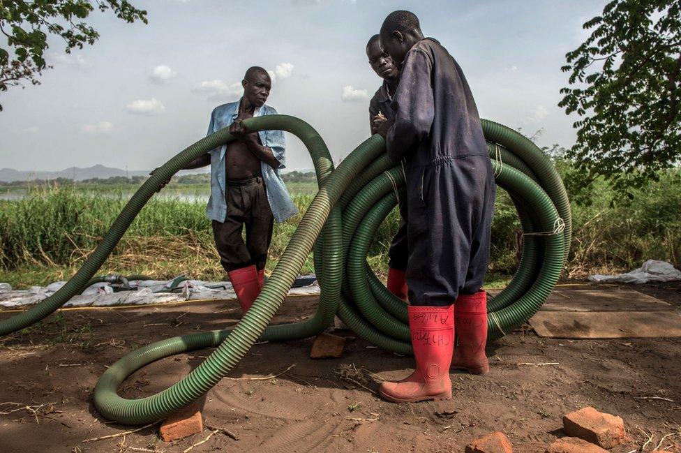 Using a system of pipes and pumps, water is drawn from the river into floatation tanks