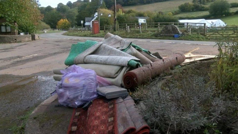 A pile of rugs and carpet