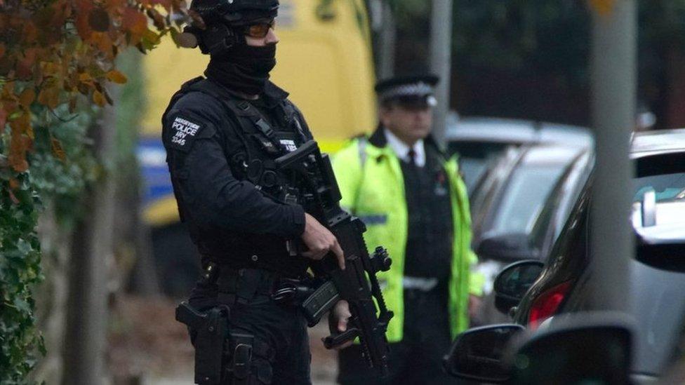 An armed police officer