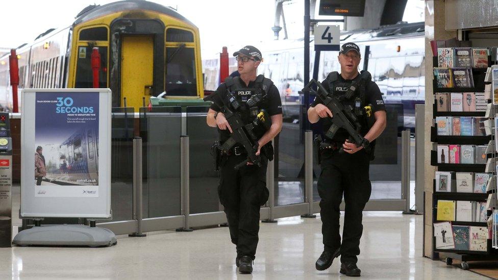 Armed police in Inverness