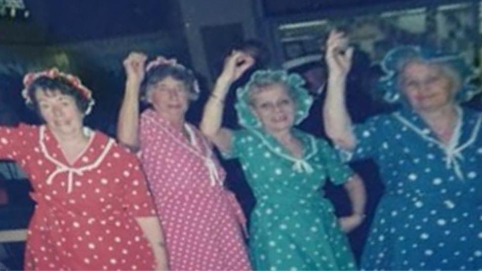 Women dancing in fancy dress