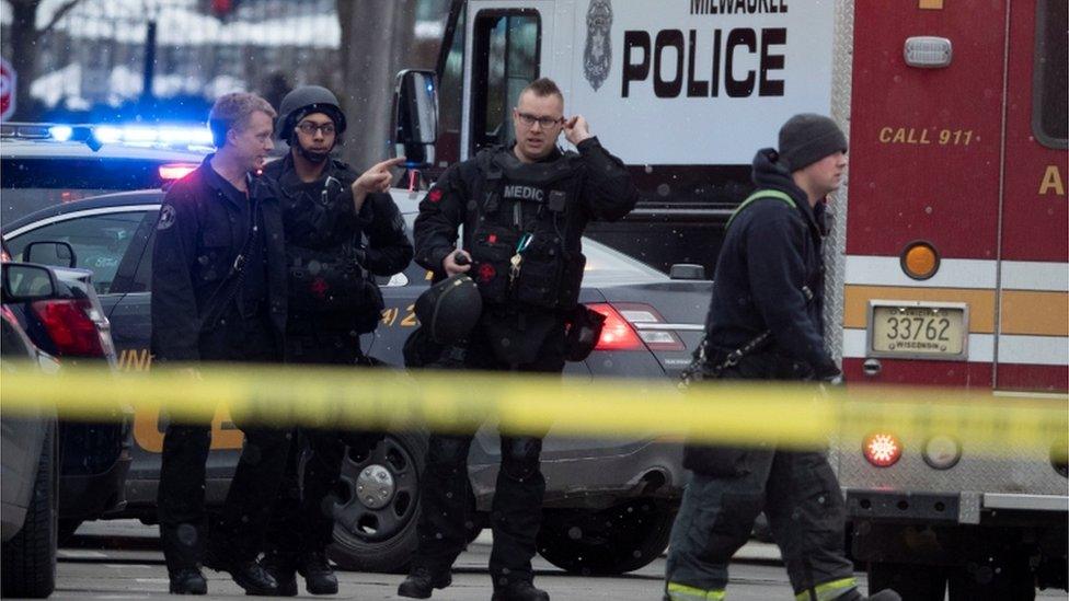 Police and emergency officials work at an active shooter scene at the Molson Coors headquarters