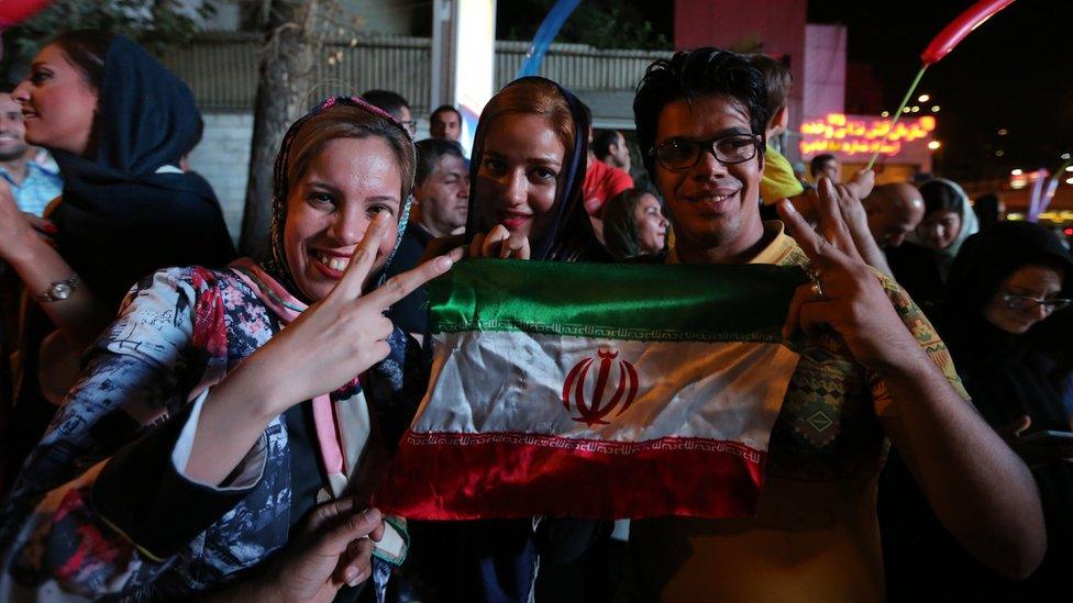 Iranians take to the streets to celebrate after Iran's nuclear negotiating team struck a deal with world powers in Vienna.