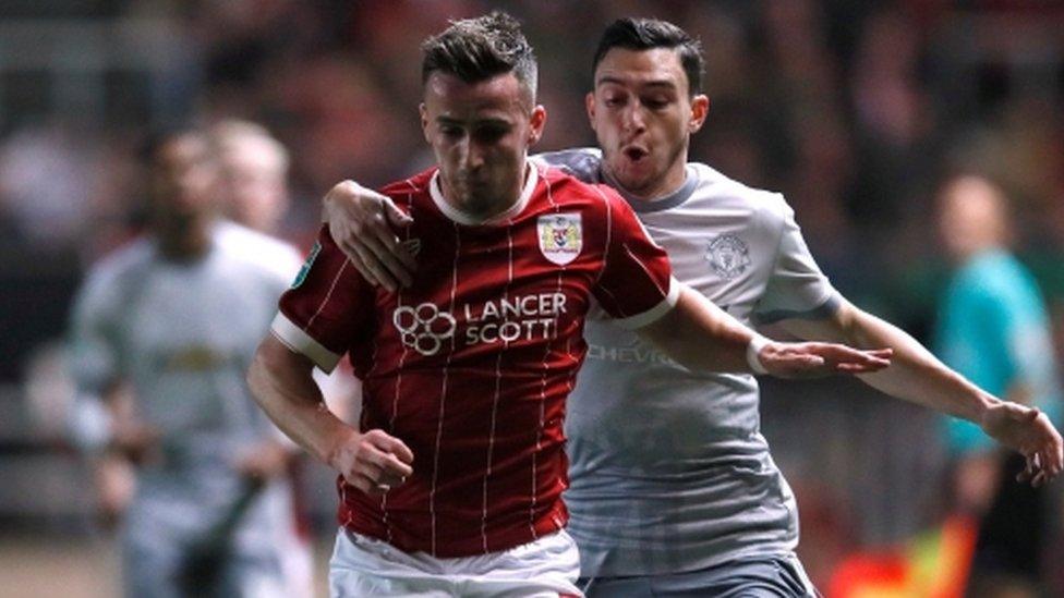 Manchester United's Matteo Darmian tries to halt Bristol City's Joe Bryan