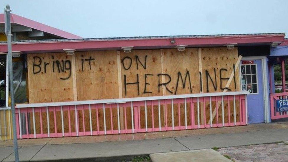 A local business with boarded up windows ahead of Hurricane Herminie's expected landfall in Cedar Key, Florida (02 September 2016)