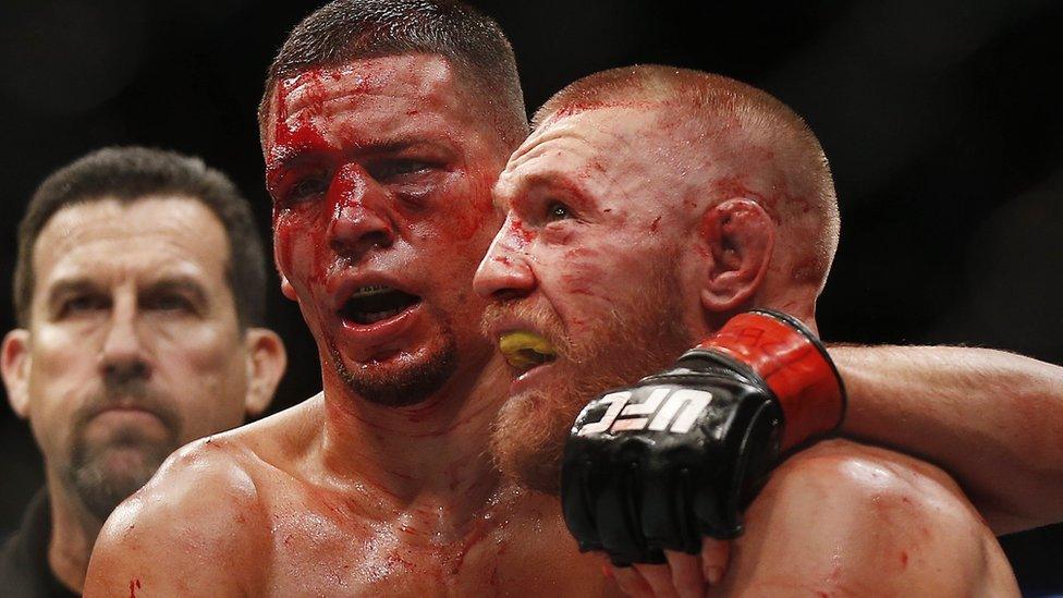 Nate Diaz and Conor McGregor embrace after the fight