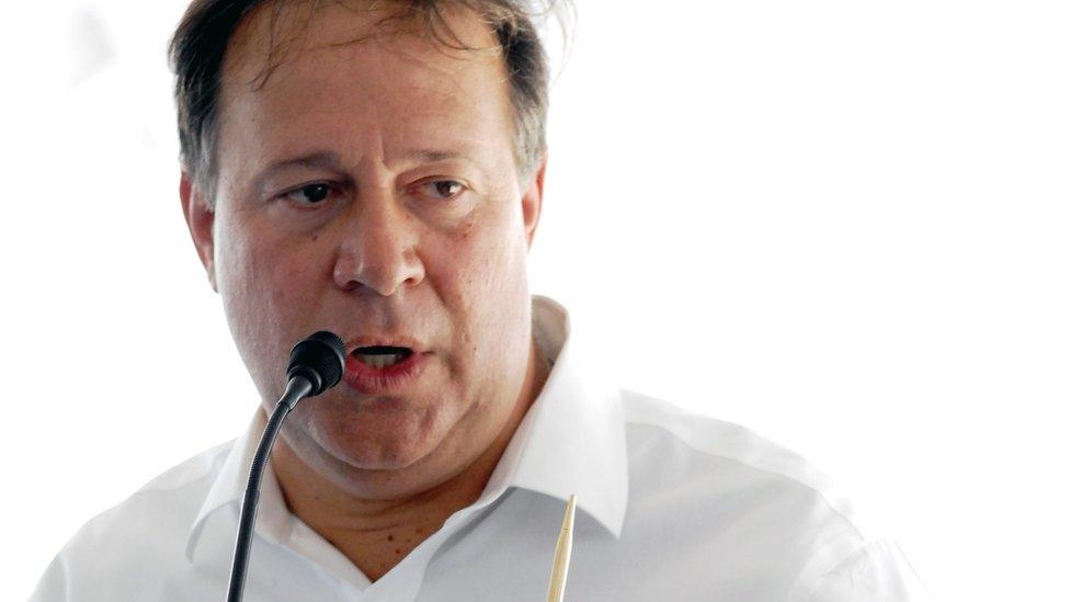 Panamanian President Juan Carlos Varela speaks with the media during an event in Colon, 80 km from Panama City on April 4, 2016.