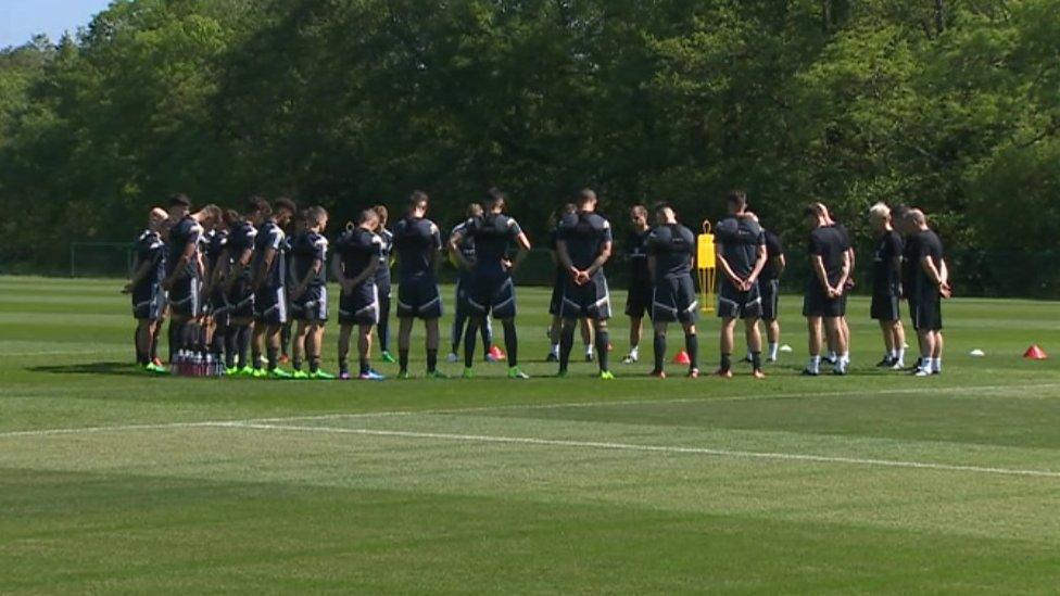 Wales' under-21 squad observe the minute's silence