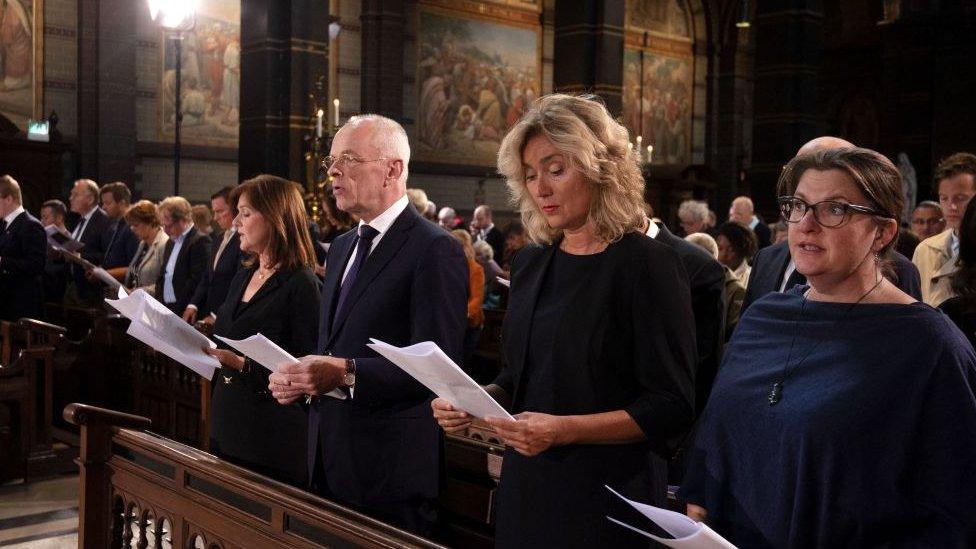 Large group of people inside of a church, including the Dutch Speaker of the House of Representatives.