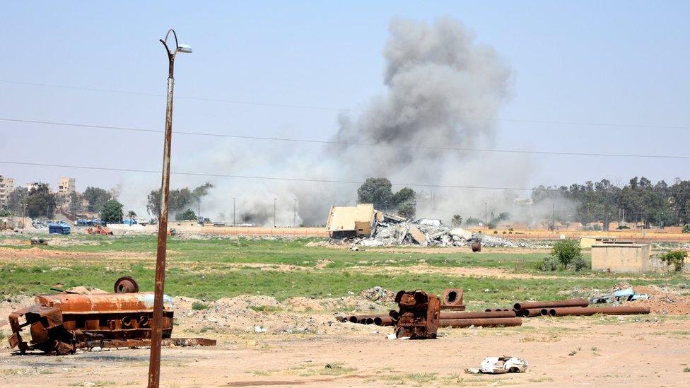 A smoke cloud billows during fighting in Raqqa city, Syria (11 June 2017)