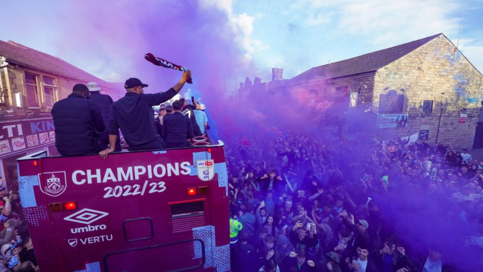 Purple smoke by the Burnley bus