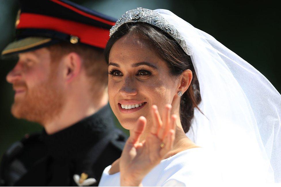 Prince Harry and Meghan Markle ride in an Ascot Landau along the Long Walk after their wedding in St George's Chapel in Windsor Castle.