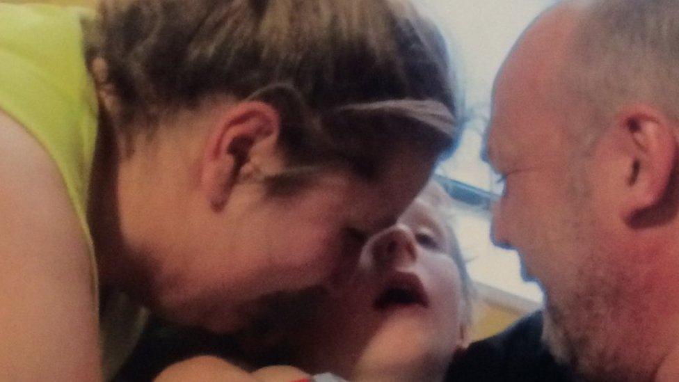 Mason Timmins with his parents, moments before he died