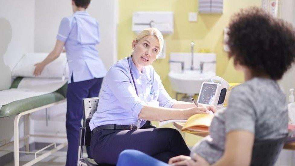 Doctor talking to patient