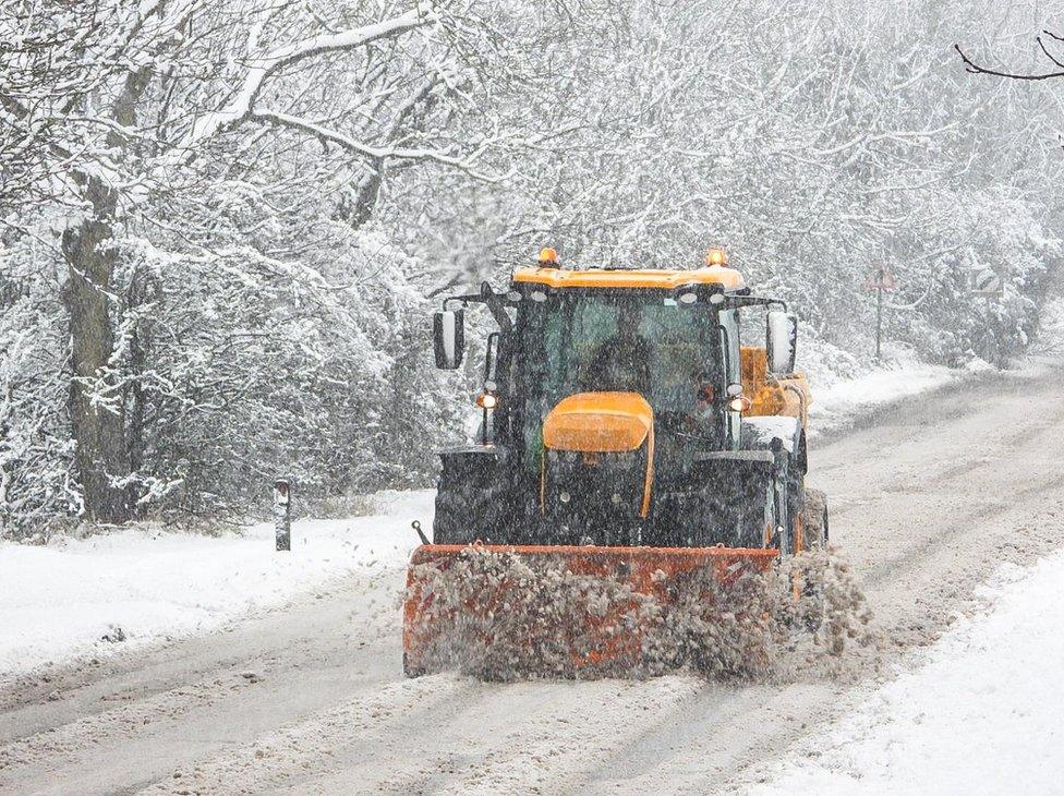 Snow plough tractor on a road