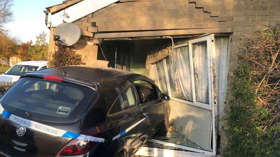 Car crashed into house