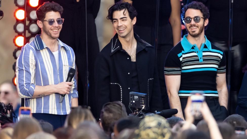 (L-R) Nick Jonas, Joe Jonas and Kevin Jonas of the Jonas Brothers are seen performing during NBC's "Today" show Citi Concert Series at Rockefeller Plaza on May 12, 2023 in New York City