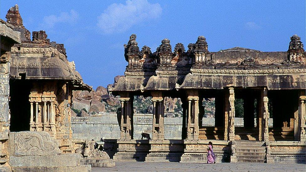 The Vittala Temple, built in the early 16th century, is devoted to the Hindu god Vithoba (also known as Vitthala and Panduranga), an incarnation of Vishnu or his avatar Krishna. Hampi is a village in northern Karnataka state. It is located within the ruins of Vijayanagara, the former capital of the Vijayanagara Empire.