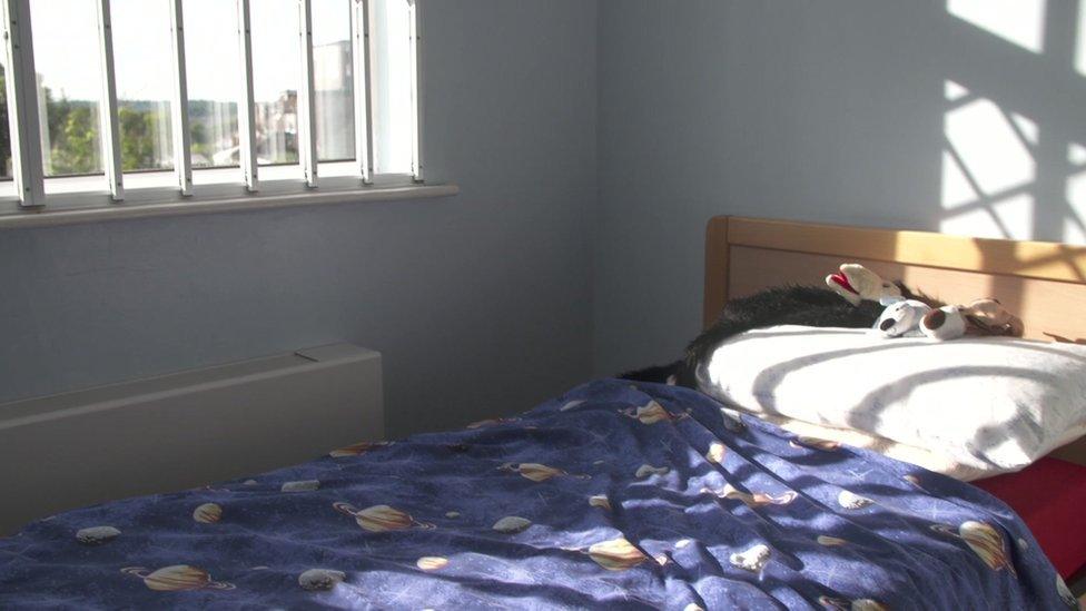 Elliot's bedroom with bars on the windows