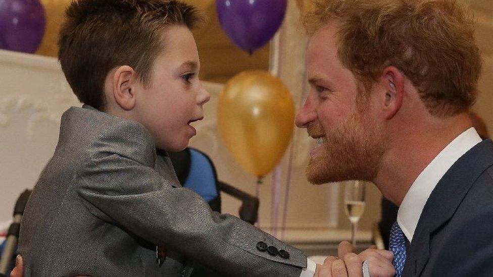 Prince Harry as he greeted Inspirational Child Award Winner Ollie Carroll, as he attended the WellChild Awards in London in October