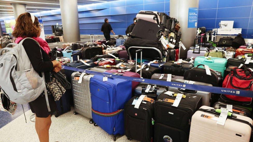 A traveler looks for baggage at Los Angeles International Airport on Thursday