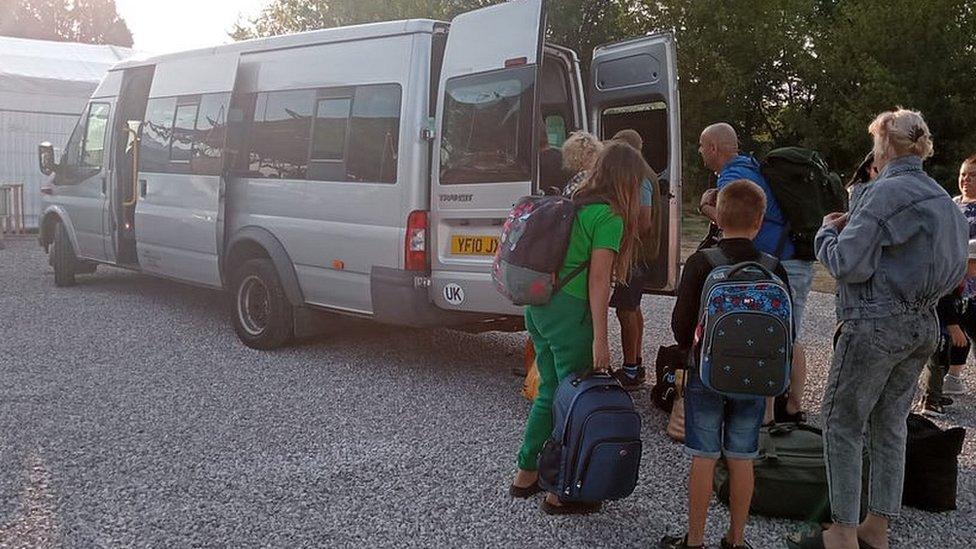 Bus and refugees queueing