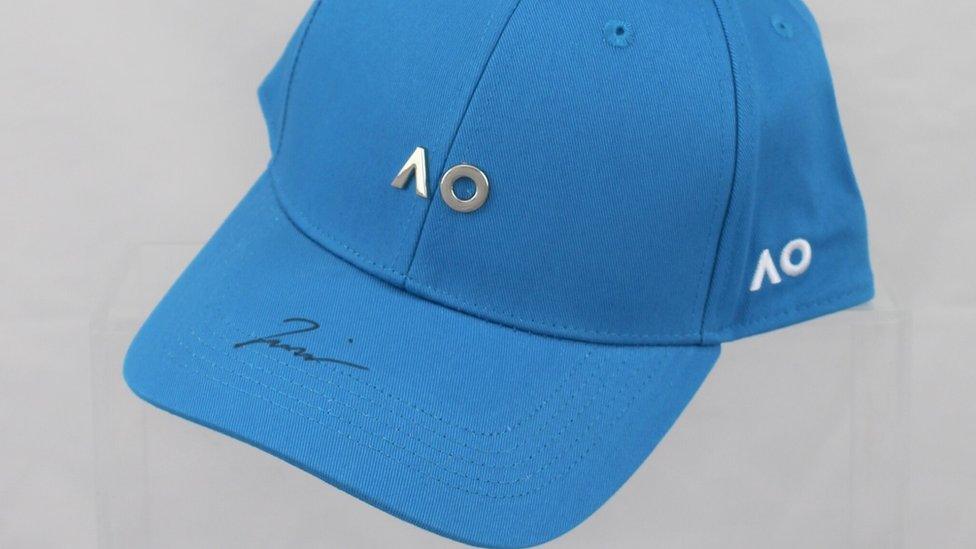 A signed cap donated by Naomi Osaka