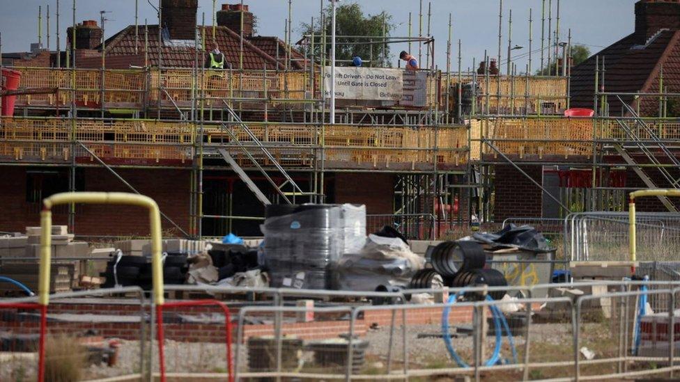 Builders at work on a new housing development