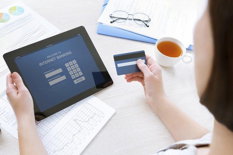 woman banking on tablet