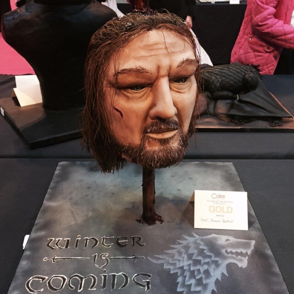 A cake version of Ned Stark's head on a spike