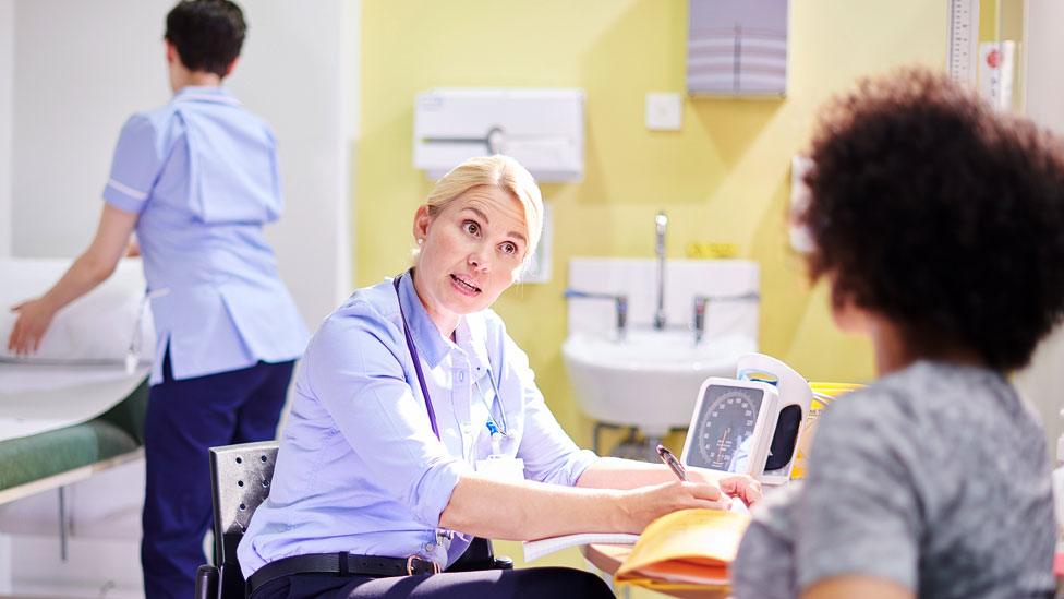 Doctor talking to patient