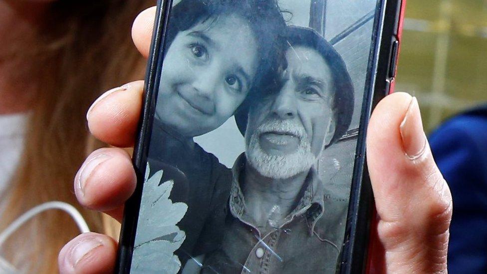 Daoub Nabi and his grandchild pictured on a mobile phone