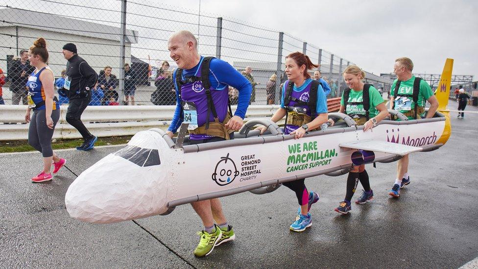 Runners dressed as aeroplane