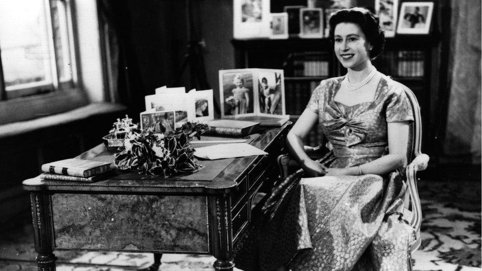 Queen Elizabeth II smiling just before the end of her first Christmas Day television speech to the nation in 1957