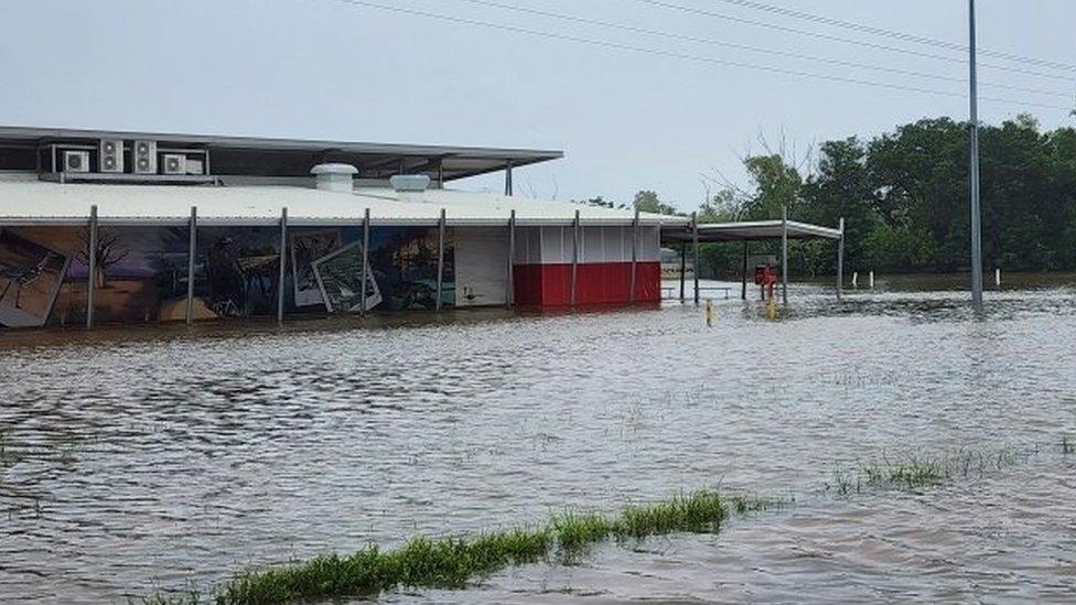 Flooding shop and road in western Australia