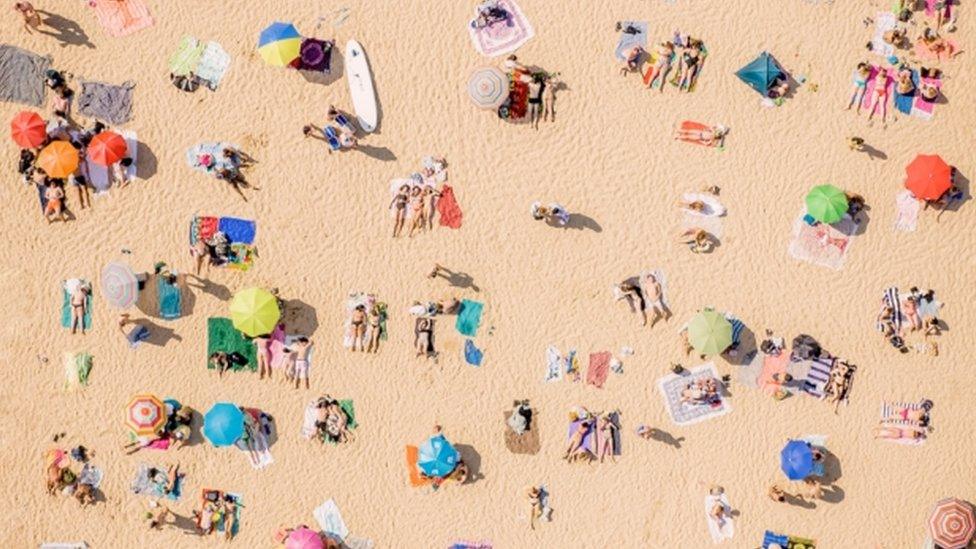 People on beach from above