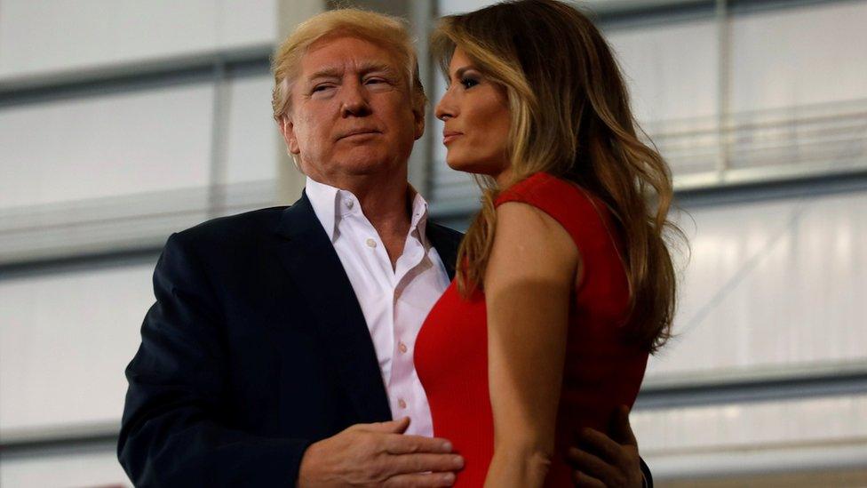 U.S. President Donald Trump hugs his wife Melania during a "Make America Great Again" rally at Orlando Melbourne International Airport in Melbourne, Florida on 18 February