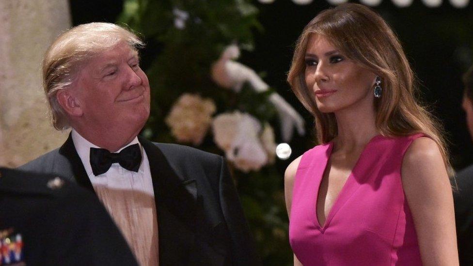 US President Donald Trump and First Lady Melania Trump arrive for the 60th Annual Red Cross Gala at his Mar-a-Lago estate in Palm Beach on February 4, 2017