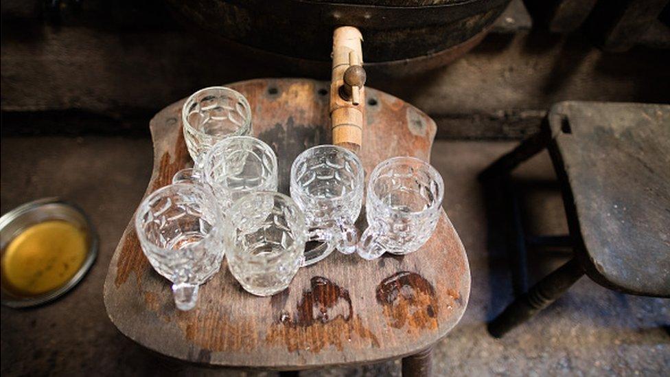 Glasses and a barrel of cider