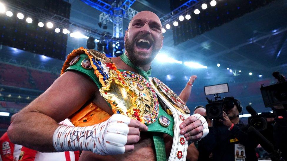 Boxer Tyson Fury seen holding his belts after beating fellow British heavyweight Dillian Whyte