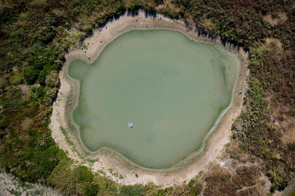 A water reservoir is seen with low water levels at Walthamstow Wetlands in London, Britain, 10 August 2022.