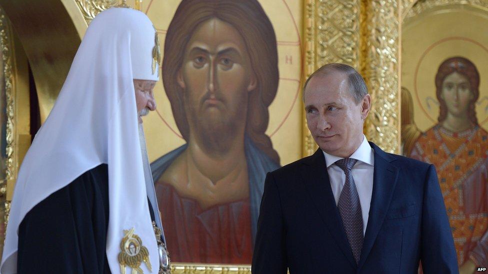 Patriarch Kirill of Moscow and All Russia (L) and Russian President Vladimir Putin (R)