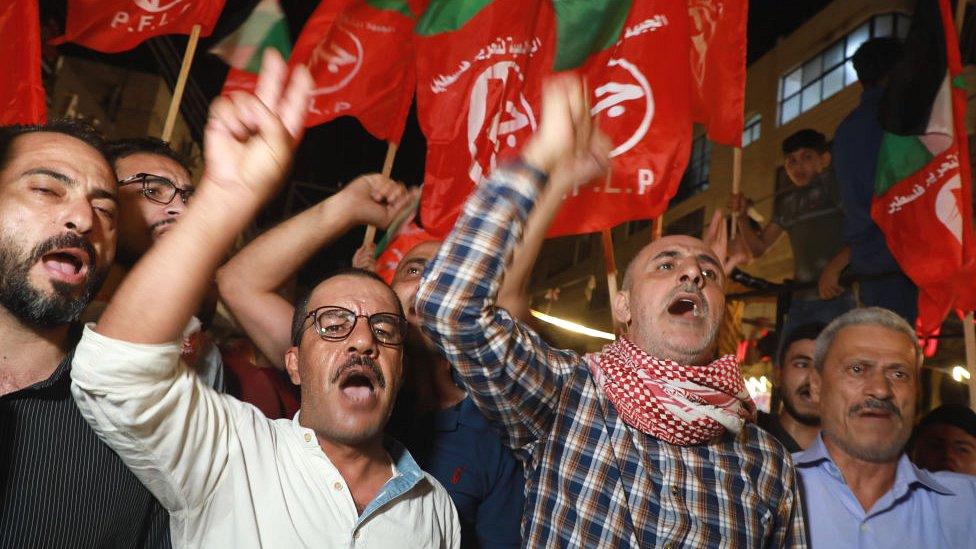 Palestinian men in crowd in Gaza City