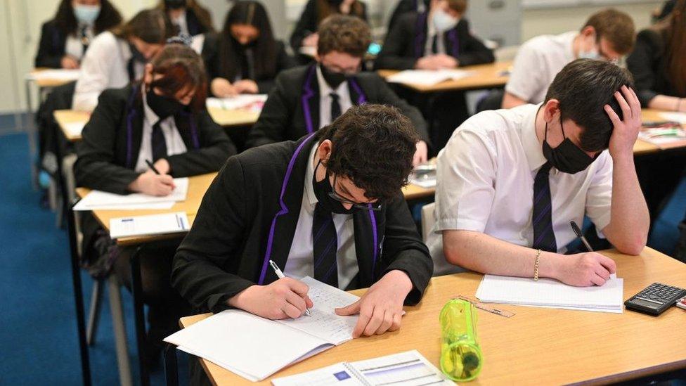 Secondary school pupils in face masks in class