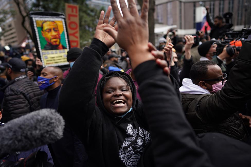 People react to the news of a guilty verdict in the trial of former Minneapolis police officer Derek Chauvin, on 20 April 2021