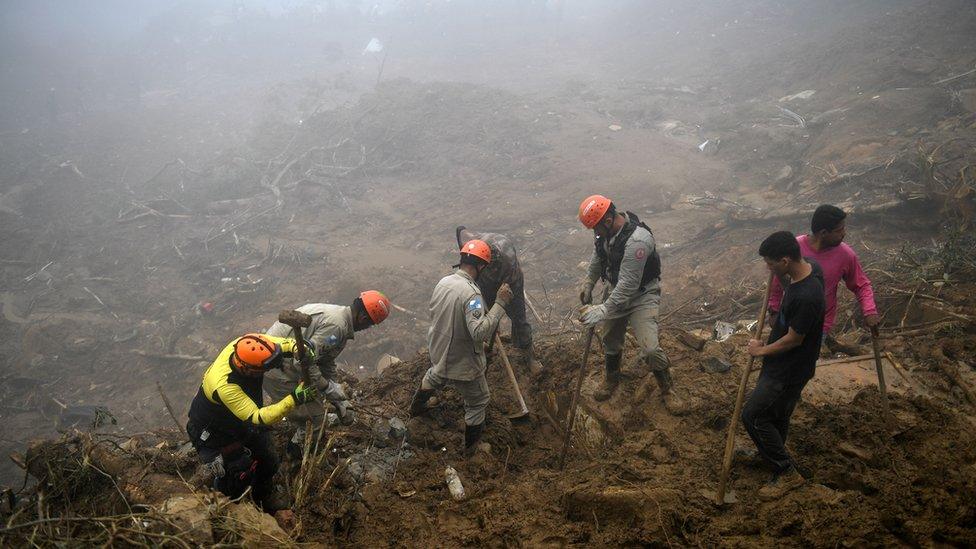 Rescue workers search for victims after a giant landslide in Petropolis on 19 February