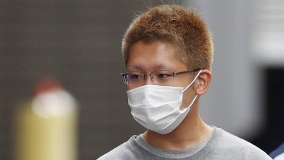 Kyota Hattori (L), a 24-year-old suspect of a knife and arson attack on a Tokyo train, is taken to prosecutors on suspicion of attempted murder, in Tokyo, Japan, 02 November 2021.