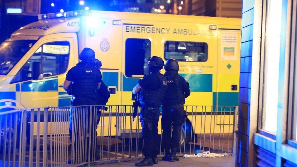 Armed police and ambulance at Manchester Arena